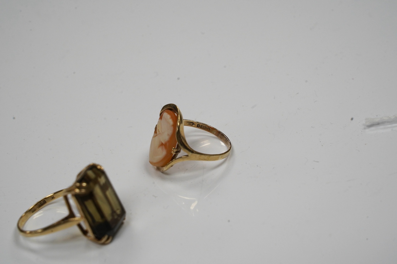 Two 9ct gold and gem set rings to include citrine and cameo shell, gross weight 8.6 grams. Condition - fair to good